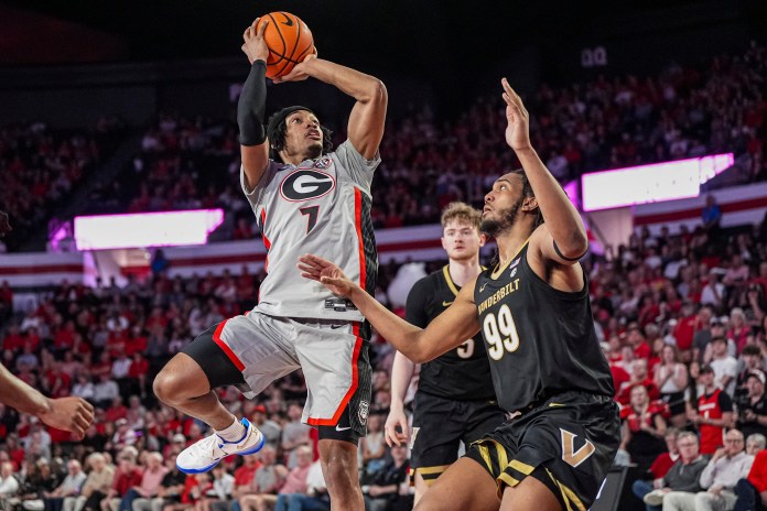 Georgia Bulldogs guard Tyrin Lawrence (7) shoots over Vanderbilt Commodores forward Devin McGlockton (99) during the first half at Stegeman Coliseum on March 8, 2025