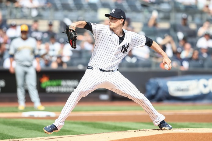 New York Yankees starting pitcher Max Fried (54) delivers a pitch in the first inning of the game against the Milwaukee Brewers at Yankee Stadium in the Bronx, New York, on March 29, 2025.