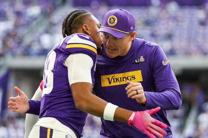 Vikings head coach Kevin O'Connell greets star wide receiver Justin Jefferson.