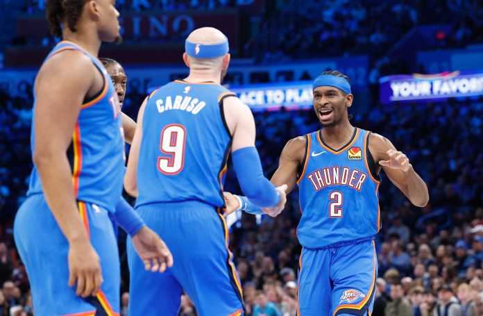Thunder superstar Shai Gilgeous-Alexander celebrates with teammates during the 2024-25 NBA season.