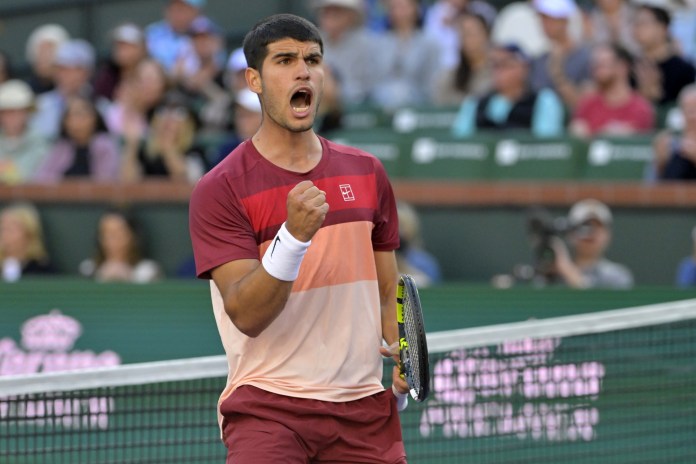 Carlos Alcaraz reacts to a big point at the 2025 BNP Paribas Open in Indian Wells.