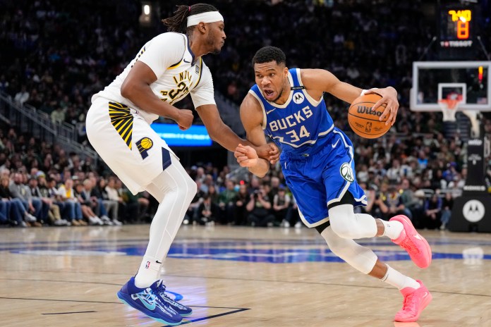Milwaukee Bucks forward Giannis Antetokounmpo (34) drives for the basket against Indiana Pacers center Myles Turner (33) during the fourth quarter at Fiserv Forum in Milwaukee, Wisconsin, on March 15, 2025.