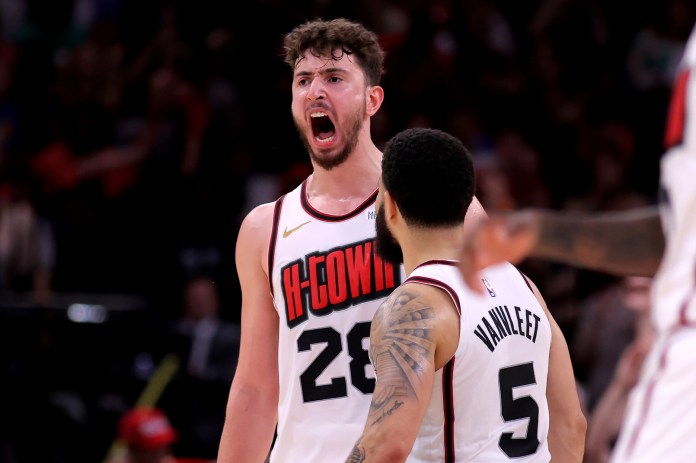 Rockets center Alperen Sengun reacts to a dunk against the Thunder during the 2024-25 NBA season.