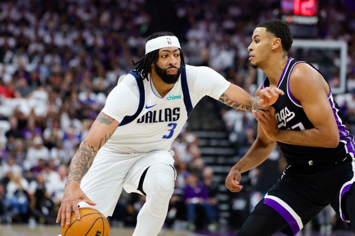 Dallas Mavericks forward Anthony Davis (3) dribbles the ball against Sacramento Kings forward Keegan Murray (13) during the first quarter at Golden 1 Center in Sacramento, California, on April 16, 2025.