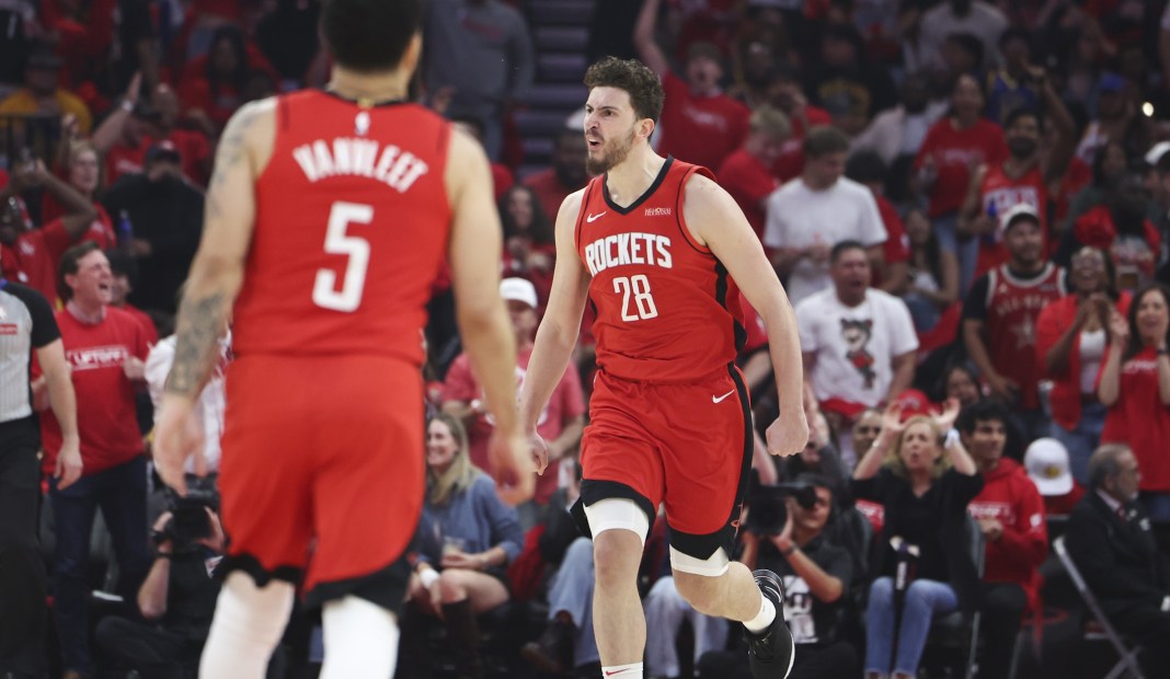 Rockets big man Alperen Sengun celebrates a basket against the Warriors during the 2024-25 NBA season.
