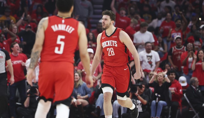 Rockets big man Alperen Sengun celebrates a basket against the Warriors during the 2024-25 NBA season.