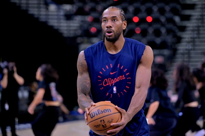 Clippers forward Kawhi Leonard warms up against the Nuggets during the 2024-25 NBA Playoffs.