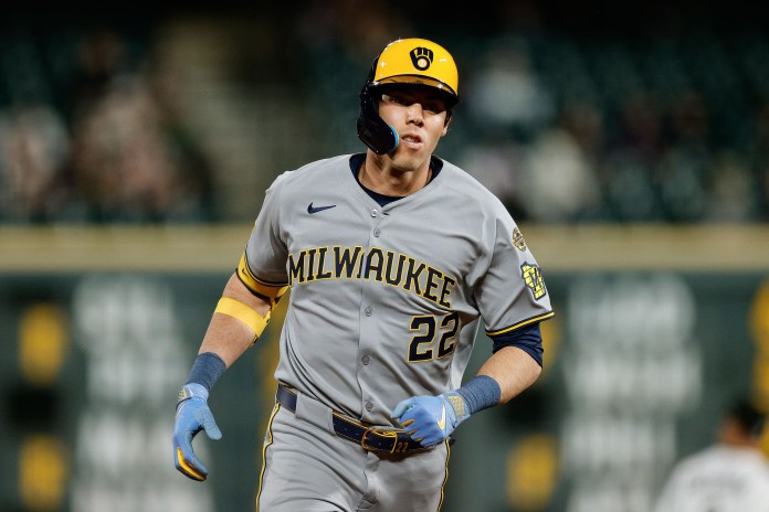 Milwaukee Brewers designated hitter Christian Yelich (22) rounds the bases after hitting a two-run home run in the ninth inning against the Colorado Rockies at Coors Field in Denver, Colorado, on April 9, 2025.