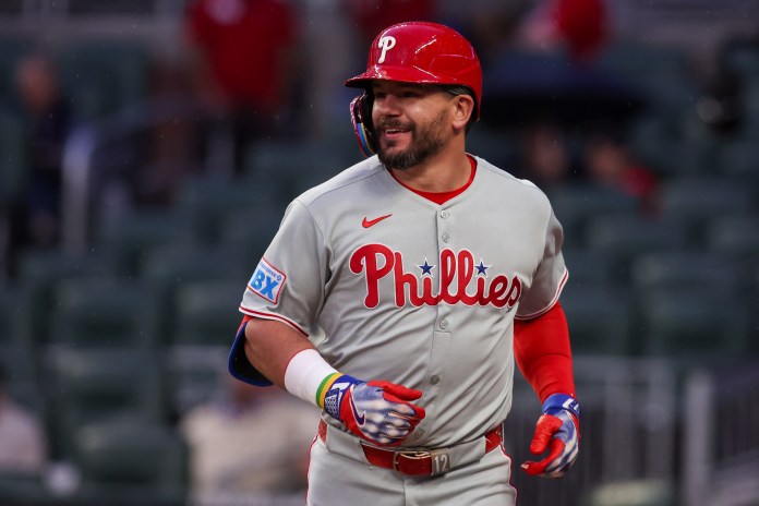 Philadelphia Phillies designated hitter Kyle Schwarber (12) celebrates after hitting a home run in the third inning against the Atlanta Braves at Truist Park in Atlanta, Georgia, on April 10, 2025.
