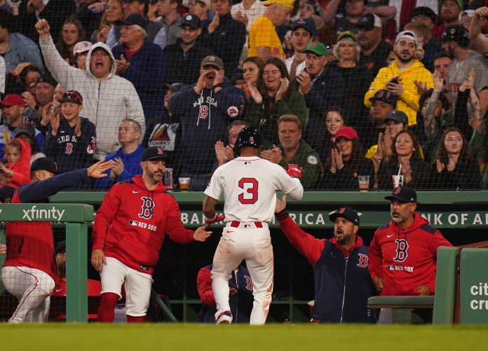 Boston Red Sox outfielder Ceddanne Rafaela (3) is congratulated after scoring against the Seattle Mariners in the third inning of the game at Fenway Park in Boston, Massachusetts, on April 22, 2025.