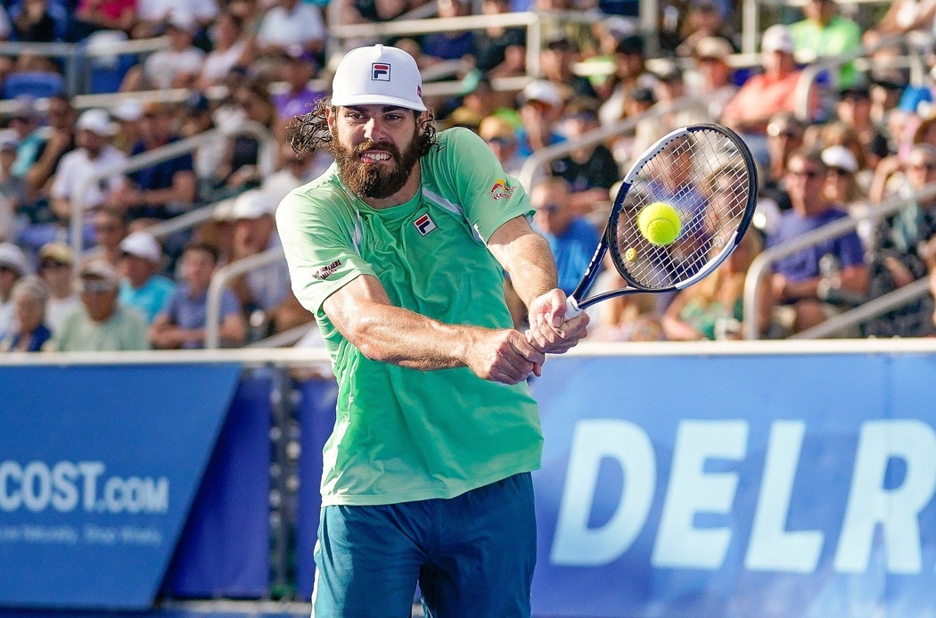 Reilly Opelka hits a backhand in Palm Beach during the 2024 tennis season.