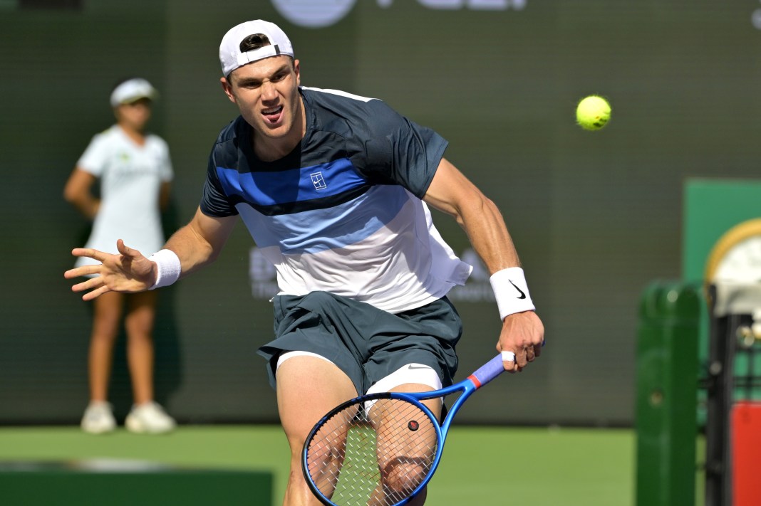 Jack Draper hits a shot against Holger Rune in the 2025 BNP Paribas Open at Indian Wells.