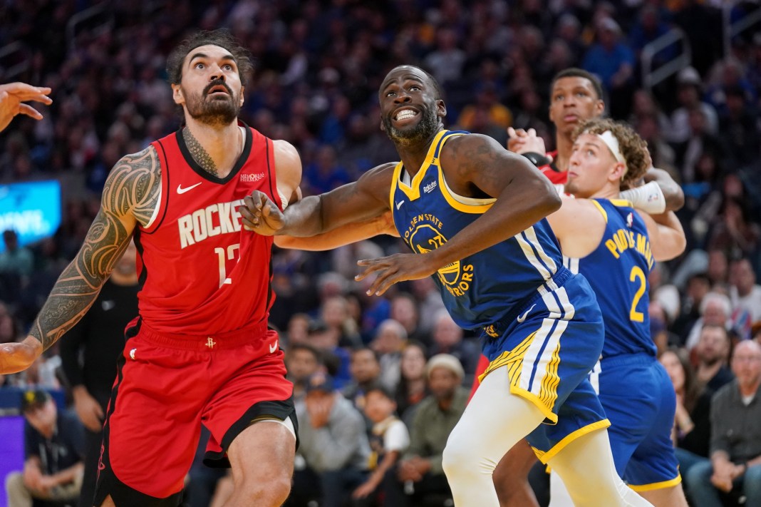 Rockets big man Steven Adams tries to get a rebound over Warriors forward Draymond Green in the 2024-25 NBA Playoffs.