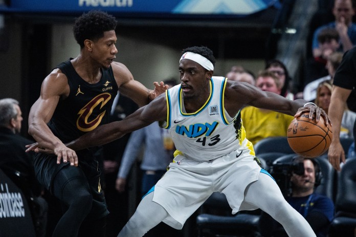 Indiana Pacers forward Pascal Siakam (43) dribbles the ball while Cleveland Cavaliers forward De'Andre Hunter (12) defends during the first half of the game at Gainbridge Fieldhouse in Indianapolis, Indiana, on April 10, 2025.