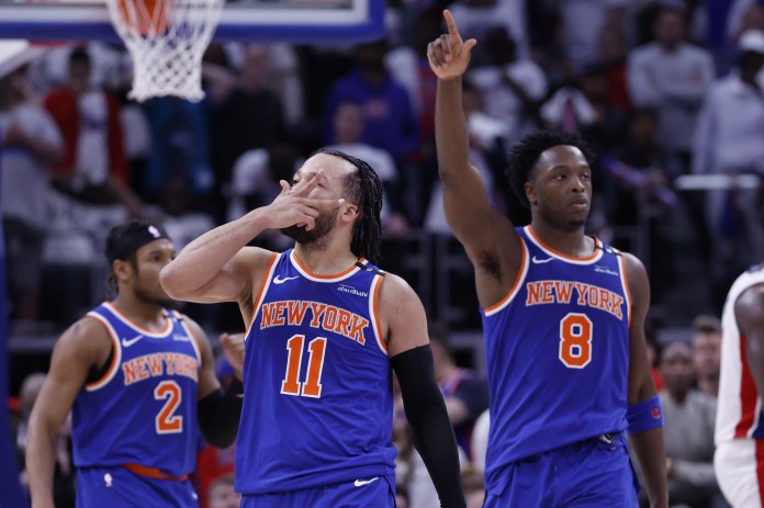 Knicks star Jalen Brunson celebrates with teammates after hitting a big shot against the Pistons during the 2024-25 NBA Playoffs.