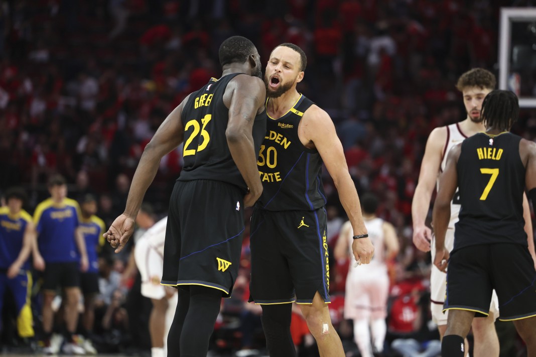 Warriors stars Stephen Curry and Draymond Green celebrate a Game 7 win over the Rockets in the 2024-25 NBA Playoffs.