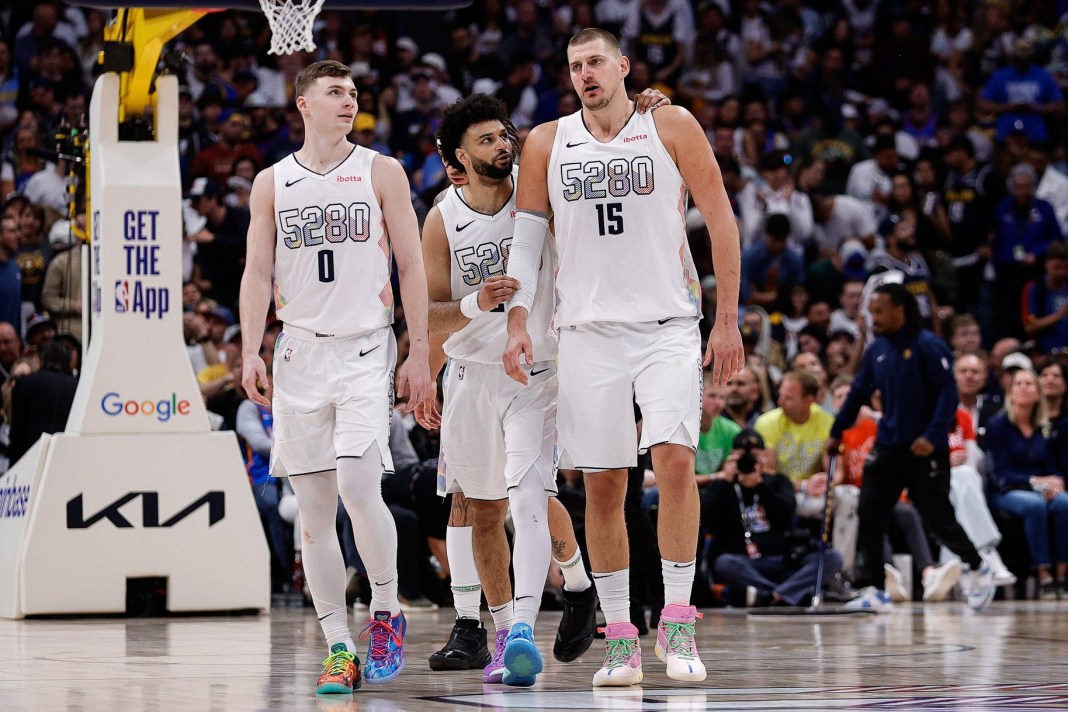 Nuggets players Nikola Jokic, Christian Braun and Jamal Murray talk during a meeting with the Thunder in Game 6 of the 2024-25 NBA Playoffs.