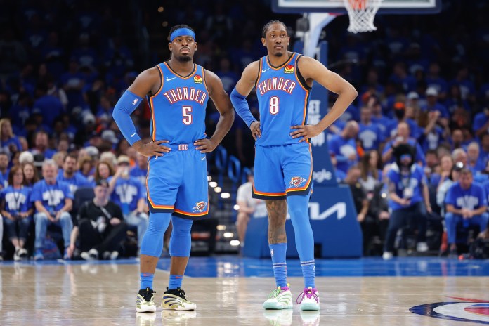 Thunder wings Jalen Williams and Luguentz Dort look on against the Nuggets during the 2024-25 NBA Playoffs.
