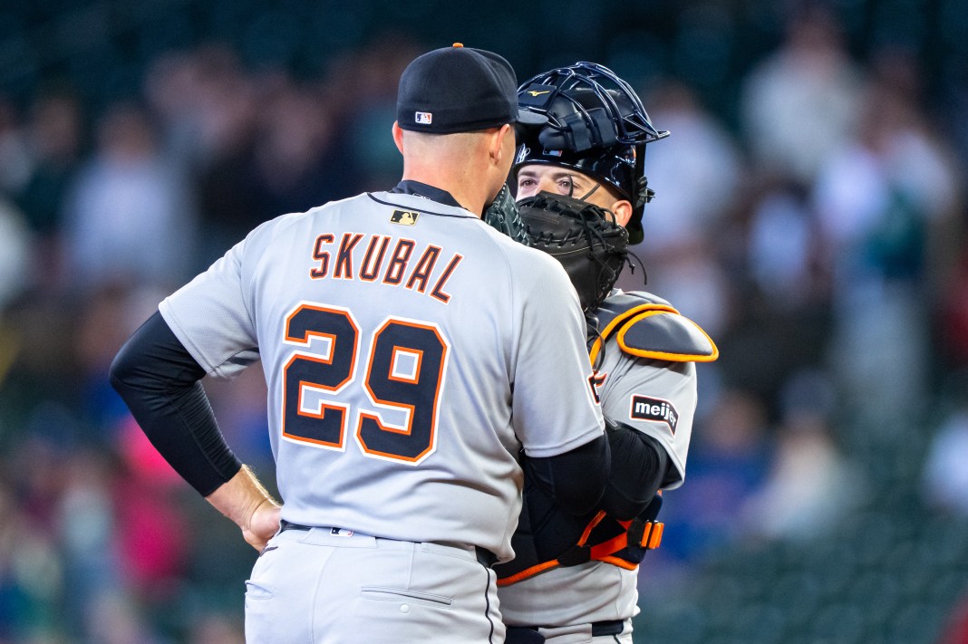 Detroit Tigers catcher Jake Rogers (34) and starting pitcher Tarik Skubal (29) meet at the mound during the second inning of the game against the Seattle Mariners at T-Mobile Park in Seattle, Washington, on April 2, 2025.
