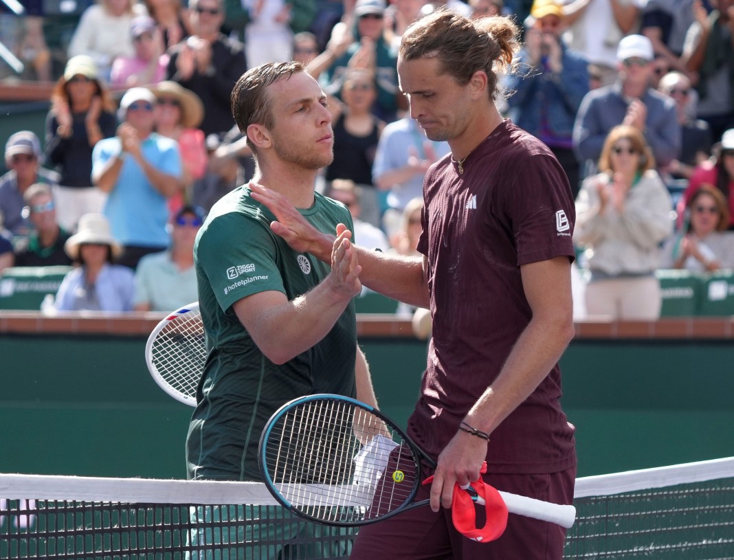 Tallon Griekspoor and Alexander Zverev meet at the net at the 2025 BNP Paribas Open in Indian Wells.