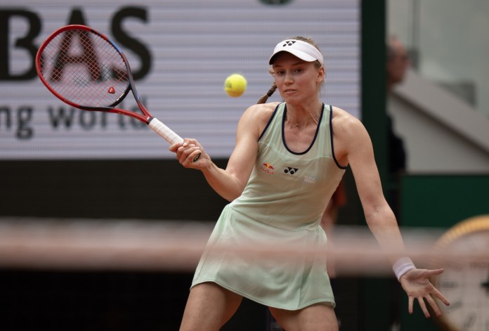 Elena Rybakina hits a shot against Iga Swiatek at the 2025 French Open at Roland Garros.