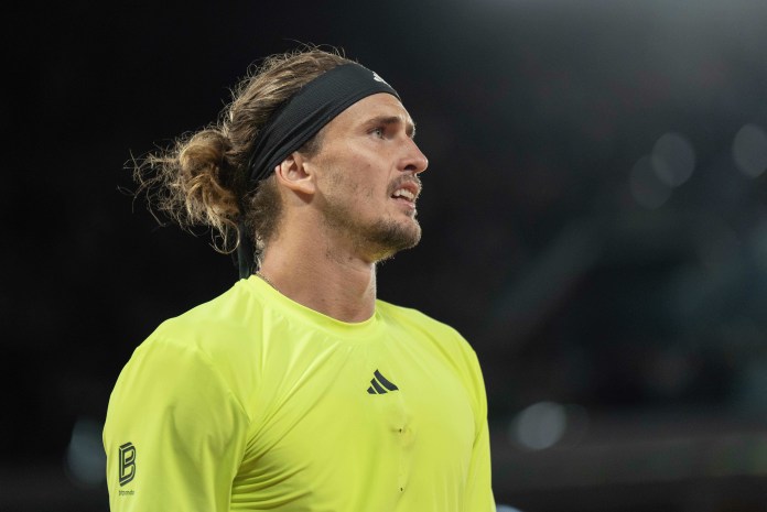 Alexander Zverev reacts during his match against Novak Djokovic in the 2025 French Open at Roland Garros.