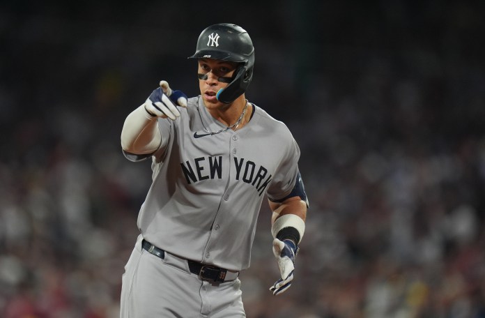 New York Yankees outfielder Aaron Judge (99) reacts to the crowd after hitting a home run against the Boston Red Sox in the ninth inning at Fenway Park in Boston, Massachusetts, on June 13, 2025.