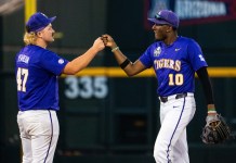 So long to Omaha LSU Tigers third baseman Michael Braswell (10) and infielder John Pearson (47) celebrate after defeating the Arkansas Razorbacks at Charles Schwab Field in Omaha, Nebraska, on June 14, 2025.