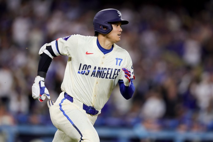 Los Angeles Dodgers designated hitter Shohei Ohtani runs the bases after hitting a solo home run during the sixth inning of a game against the San Francisco Giants at Dodger Stadium in Los Angeles, California, on June 14, 2025.