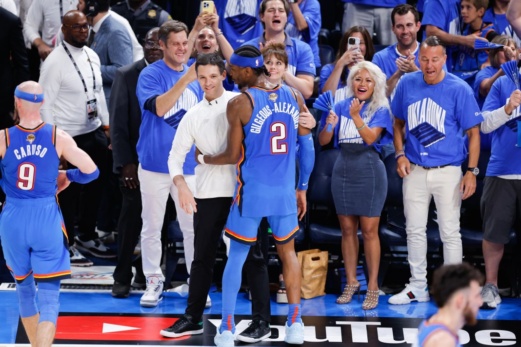 Thunder MVP Shai Gilgeous-Alexander celebrates the 2024-25 NBA title with head coach Mark Daigneault.