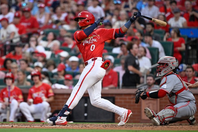 St. Louis Cardinals shortstop Masyn Winn (0) hits an RBI single against the Cincinnati Reds in the seventh inning at Busch Stadium in St. Louis, Missouri, on June 20, 2025.