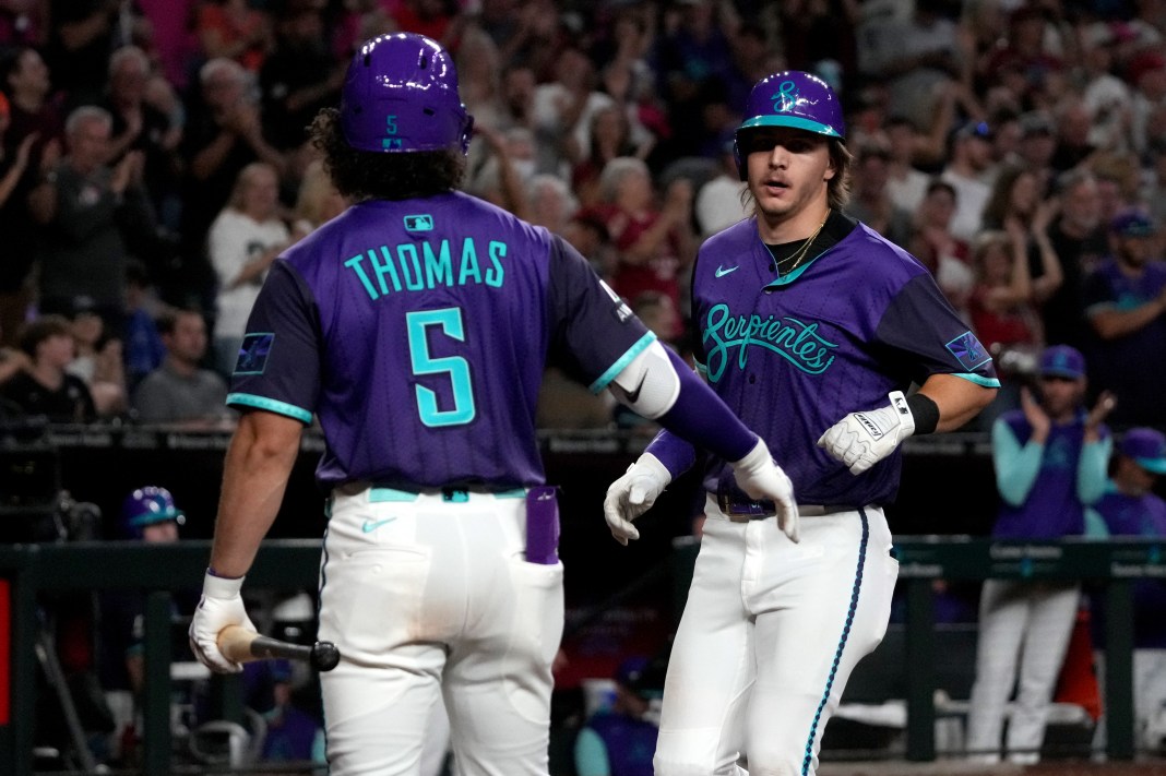 Arizona Diamondbacks outfielder Jake McCarthy (31) celebrates with outfielder Alek Thomas (5) after hitting a solo home run against the Miami Marlins in the fifth inning at Chase Field on June 27, 2025.