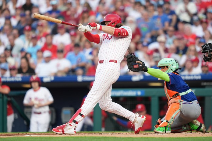 Philadelphia Phillies infielder Alec Bohm (28) hits a single against the New York Mets in the first inning at Citizens Bank Park in Philadelphia, Pennsylvania, on June 21, 2025.