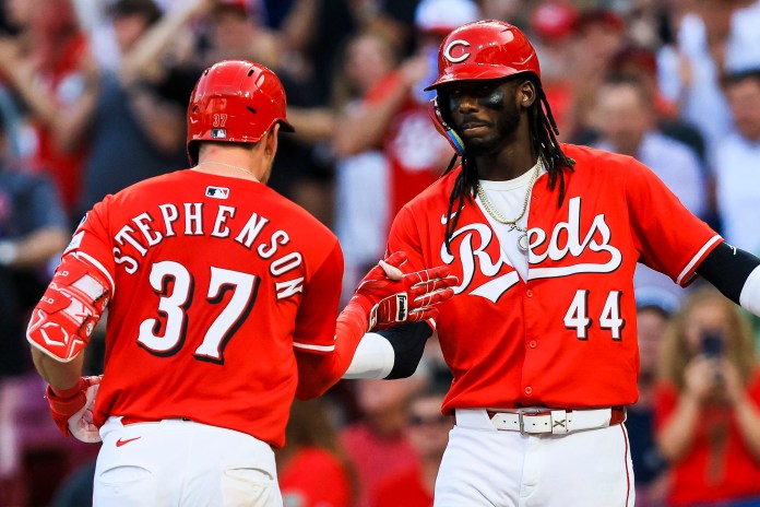 Cincinnati Reds catcher Tyler Stephenson (37) high fives shortstop Elly De La Cruz (44) after hitting a two-run home run in the fourth inning against the Milwaukee Brewers at Great American Ball Park in Cincinnati, Ohio, on June 3, 2025.