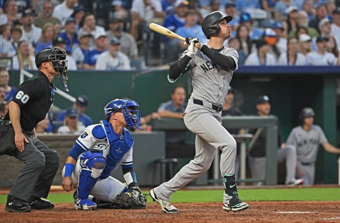 New York Yankees right fielder Cody Bellinger (35) singles in a run during the sixth inning of the game against the Kansas City Royals at Kauffman Stadium in Kansas City, Missouri, on June 10, 2025.