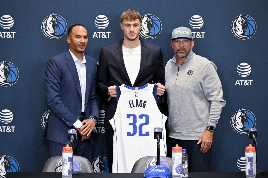 Mavericks rookie Cooper Flagg poses with Jason Kidd and Nico Harrison after the 2025 NBA Draft.