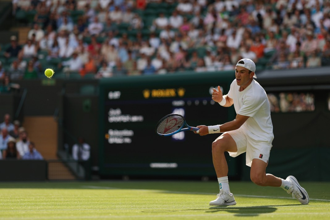Jack Draper hits a shot against Sebastian Baez at Wimbledon in 2025.
