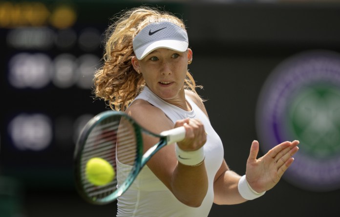 Mirra Andreeva hits a forehand against Lucia Bronzetti at Wimbledon in 2025.