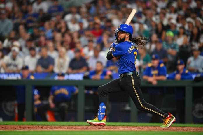 Seattle Mariners shortstop J.P. Crawford (3) hits an RBI single against the Houston Astros during the eighth inning at T-Mobile Park in Seattle, Washington, on July 18, 2025. Mandatory Credit: Steven Bisig-Imagn Images.