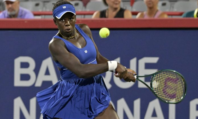 Victoria Mboko hits a backhand against Sofia Kenin at the 2025 National Bank Open in Montreal.