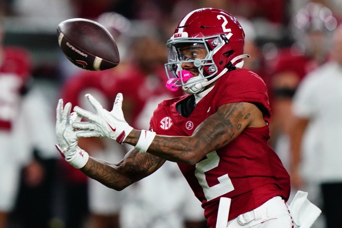 Alabama wide receiver Ryan Williams looks to haul in a pass against Georgia during the 2024 college football season.