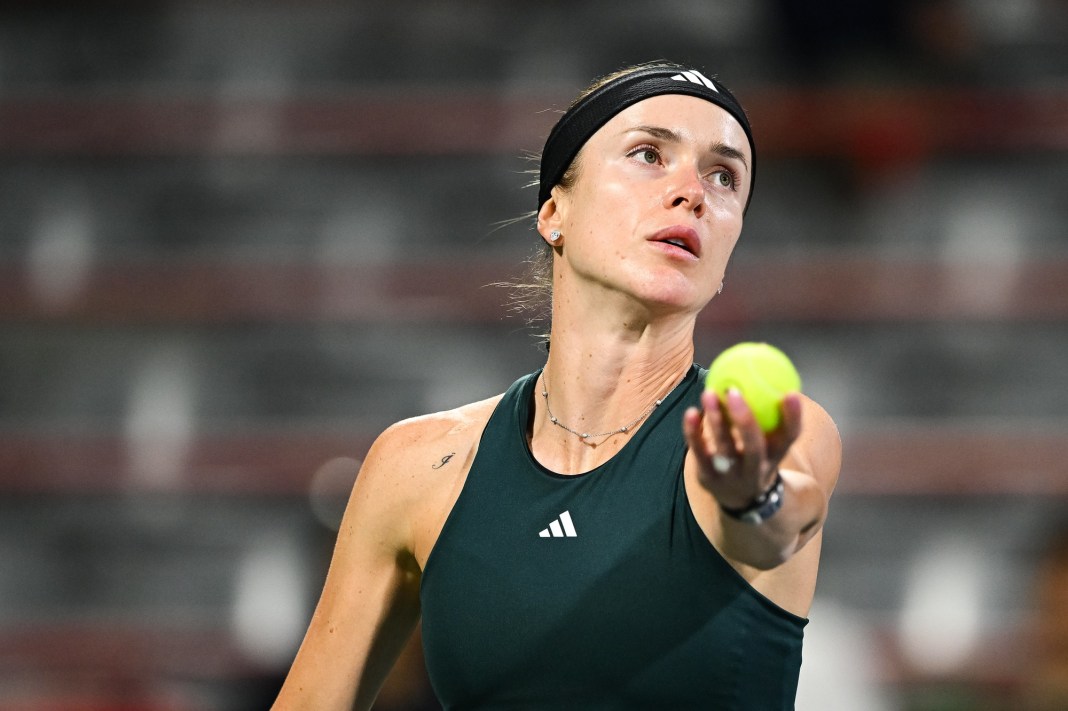 Elina Svitolina looks to serve against Kamila Rakhimova at the 2025 National Bank Open in Montreal.