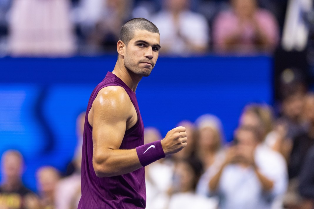 Carlos Alcaraz pumps his fist during a match against Mattia Bellucci at the 2025 US Open.