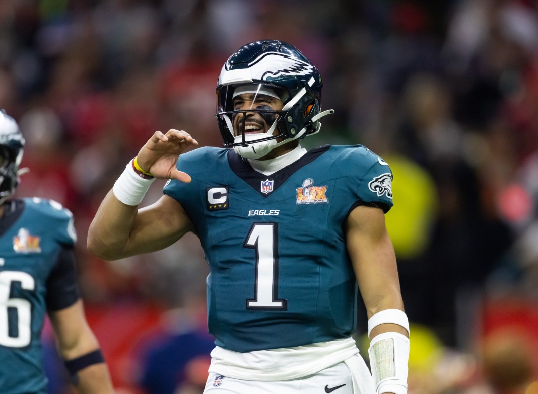 Eagles quarterback Jalen Hurts gestures to his team against the Chiefs in Super Bowl LIX.