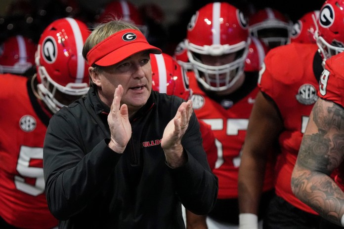 Georgia head coach Kirby Smart gets his team ready for a meeting with Texas in the 2024 SEC Championship Game.