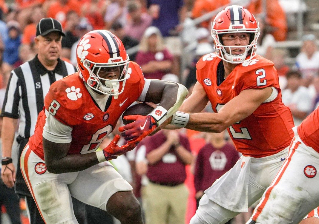 Clemson star Cade Klubnik hands the ball off against Troy during the 2025 college football season.