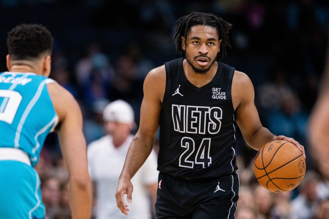 Nets guard Cam Thomas dribbles against the Hornets during the 2024-25 NBA season.
