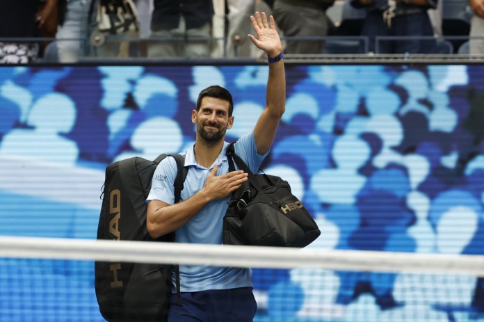 Novak Djokovic walks off the court after a loss to Carlos Alcaraz at the 2025 US Open.
