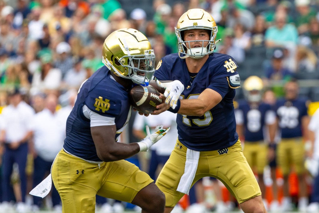 Notre Dame quarterback CJ Carr hands the ball off to Jeremiyah Love during the 2025 college football season.