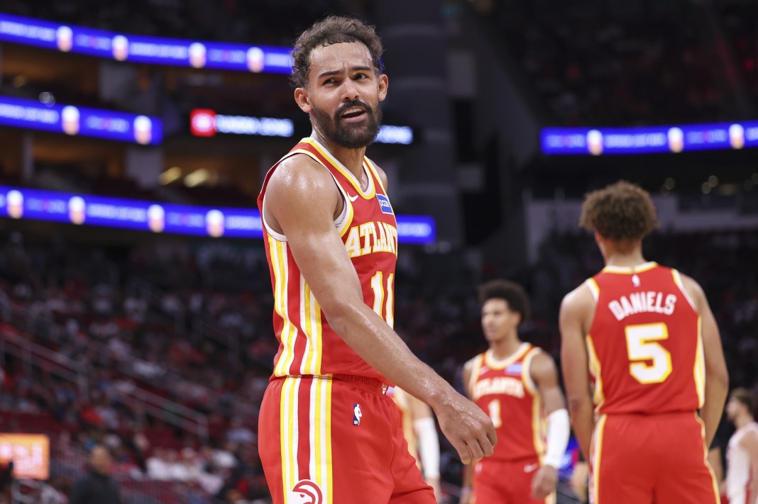 Hawks star Trae Young walks in a meeting with the Rockets during the 2025-26 NBA preseason.